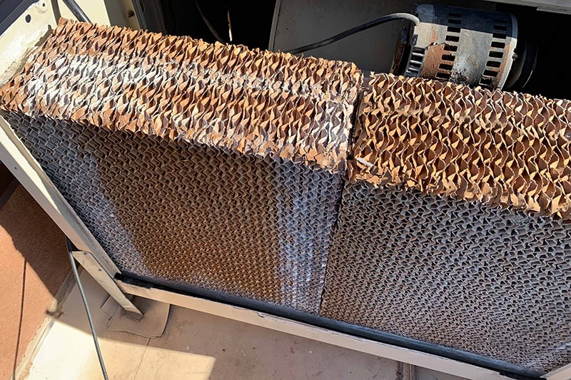 An air conditioner's coils all rusted.