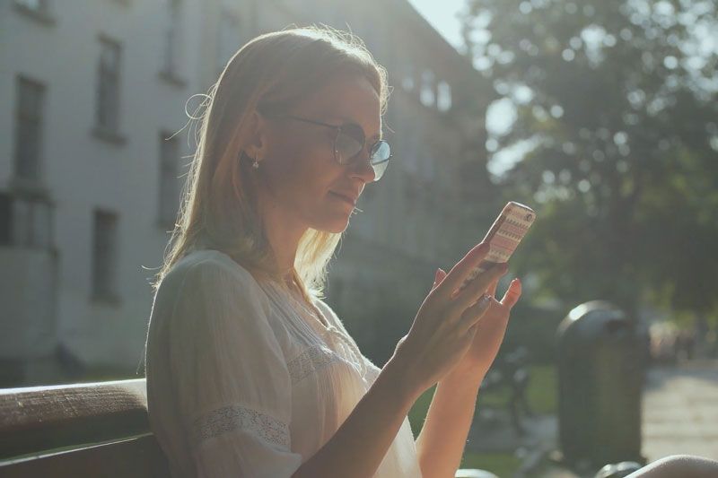 Image of someone on their phone. Video - Are Wi-Fi Thermostats Cost-Effective?